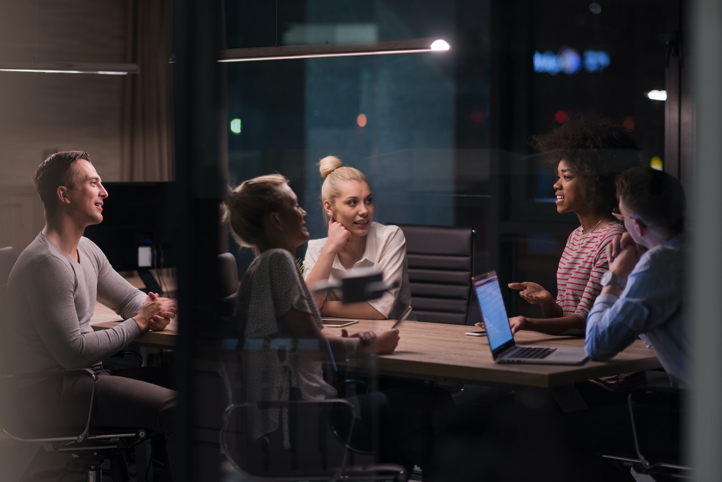 A group of people having a meeting in a boardroom for CFO advisory